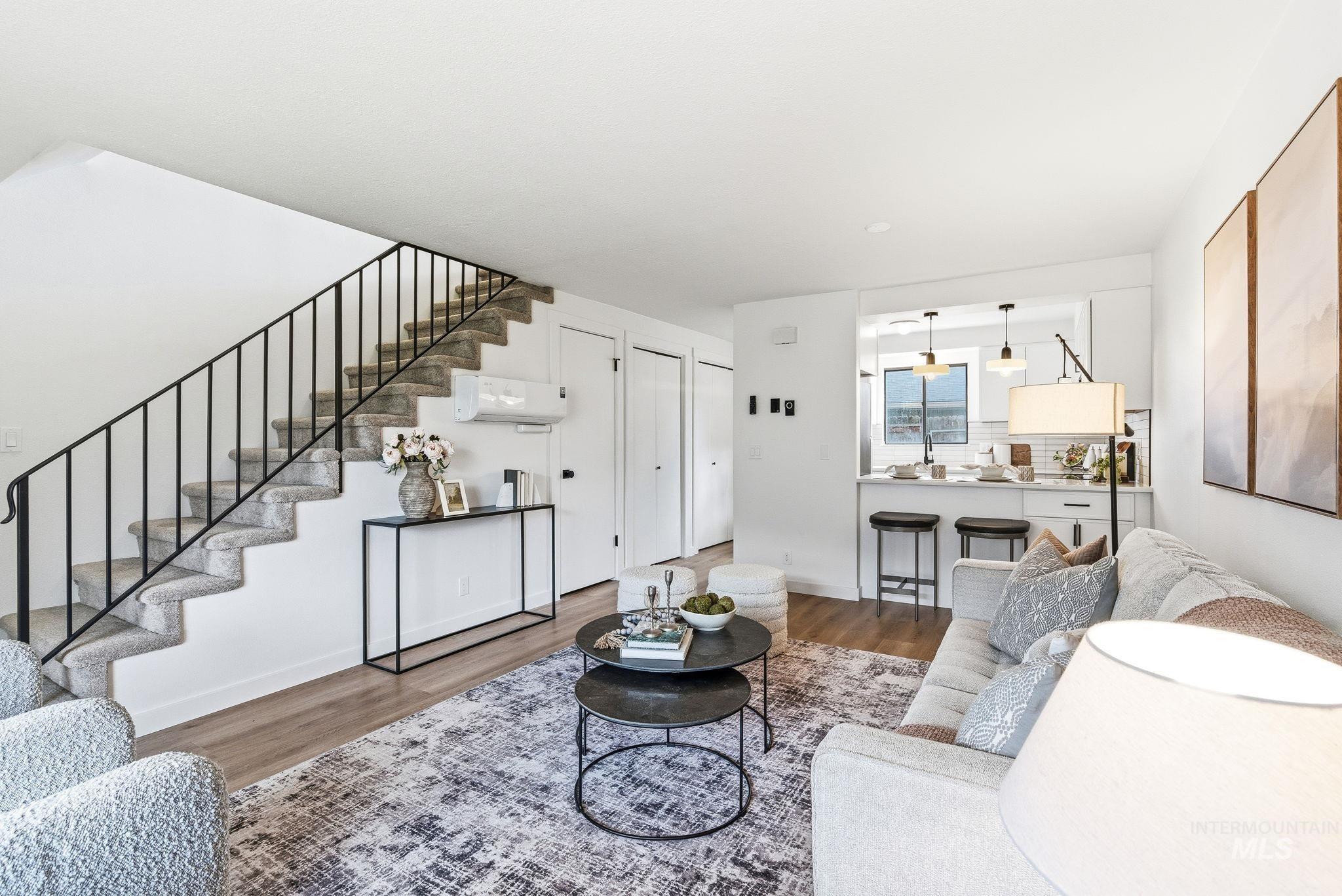 8443 West Rifleman Street Boise, ID 83704 - Photo 5 of 39 Living room with stairway and wood finished floors