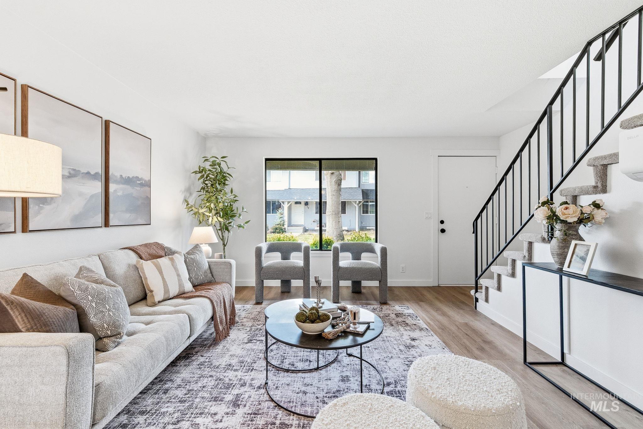 8443 West Rifleman Street Boise, ID 83704 - Photo 7 of 39 Living area with stairway and wood finished floors