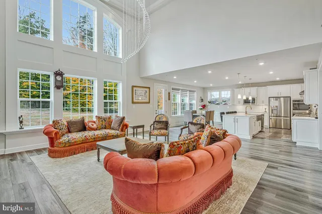 a view of a livingroom with furniture and a flat screen tv