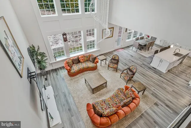 a dining room with wooden floor and window