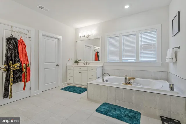 a kitchen with stainless steel appliances granite countertop a sink and a stove