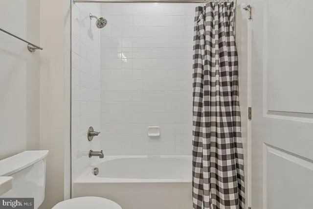 a brick house with a yard in front of it