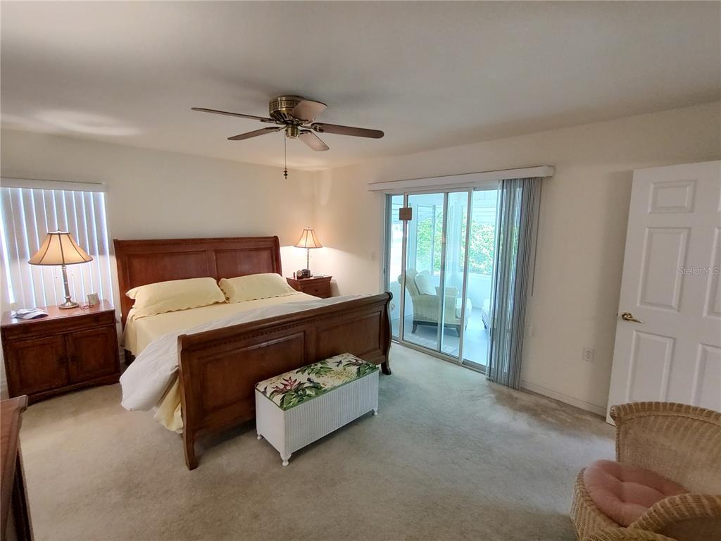 14191 Southwest 115th Terrace Dunnellon, FL 34432 - Photo 18 of 36 a bed room with a bed and a window