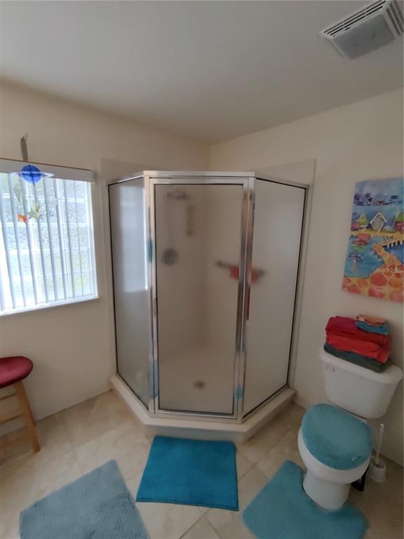 14191 Southwest 115th Terrace Dunnellon, FL 34432 - Photo 19 of 36 a bathroom with a shower and a toilet