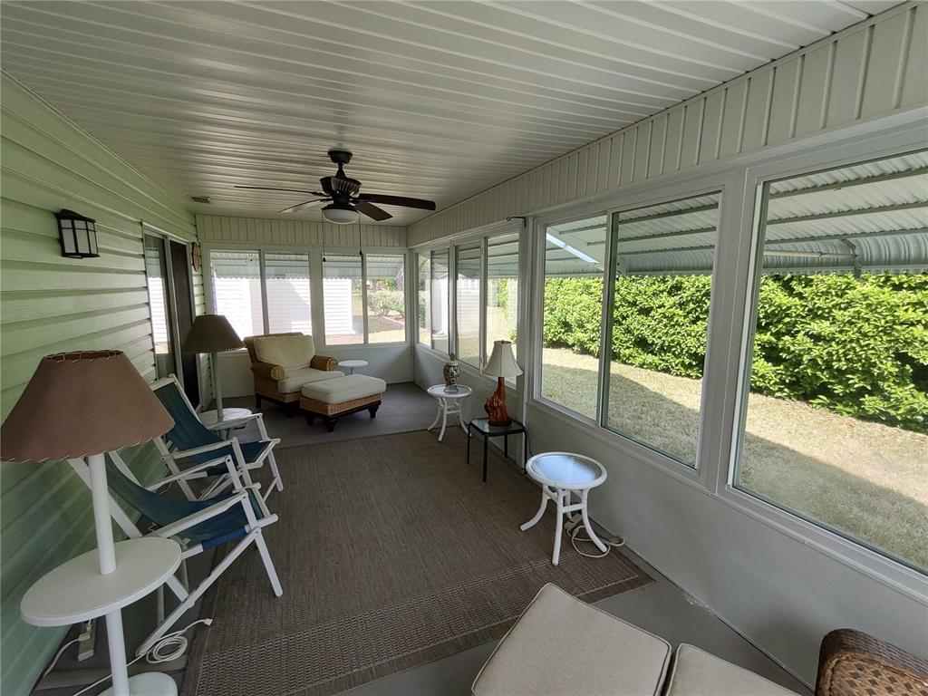 14191 Southwest 115th Terrace Dunnellon, FL 34432 - Photo 29 of 36 a living room with furniture and a large window