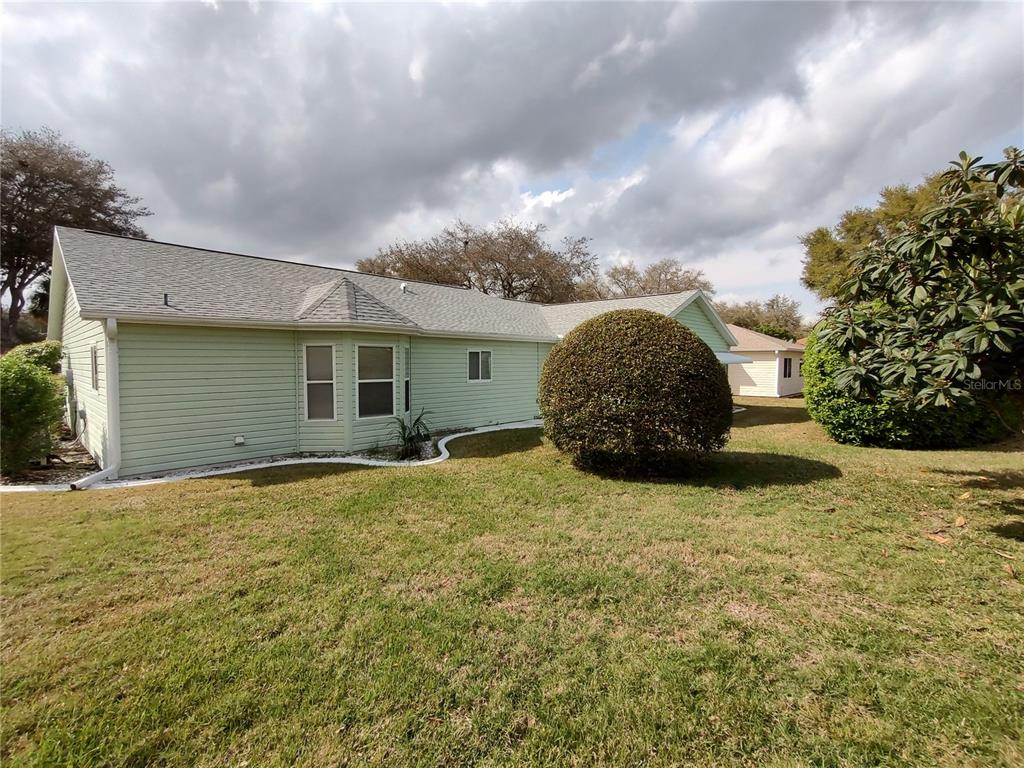 14191 Southwest 115th Terrace Dunnellon, FL 34432 - Photo 32 of 36 a view of a house with backyard and garden