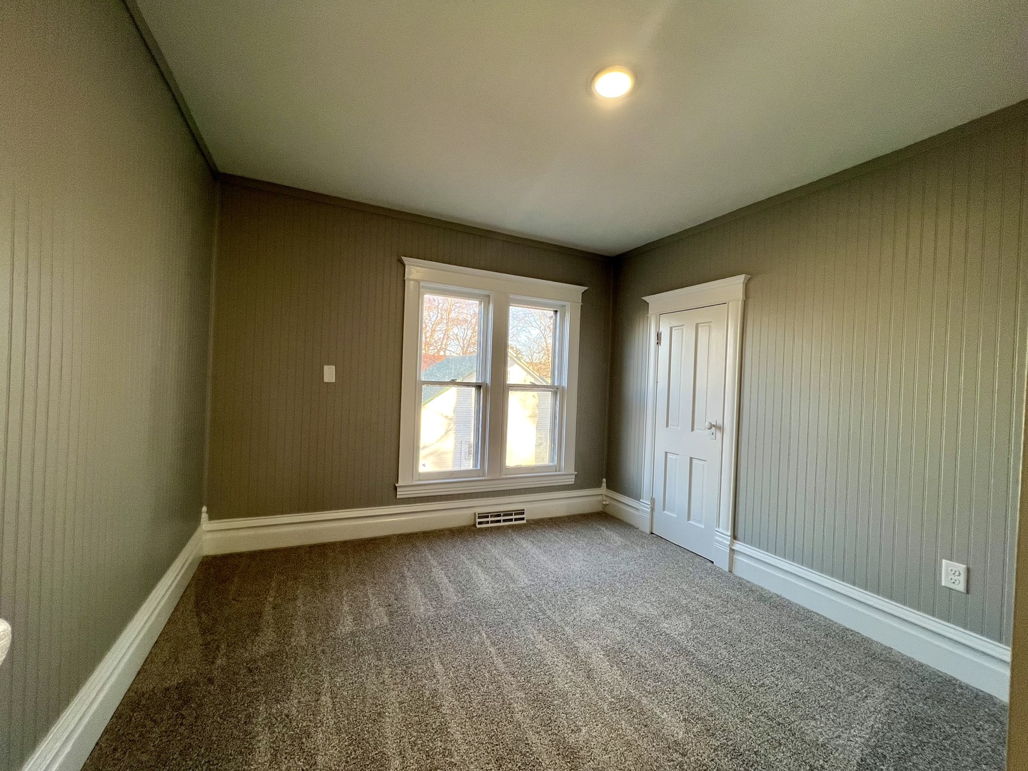 200 East South Street Ellsworth, IL 61737 - Photo 15 of 19 an empty room with wooden floor and windows