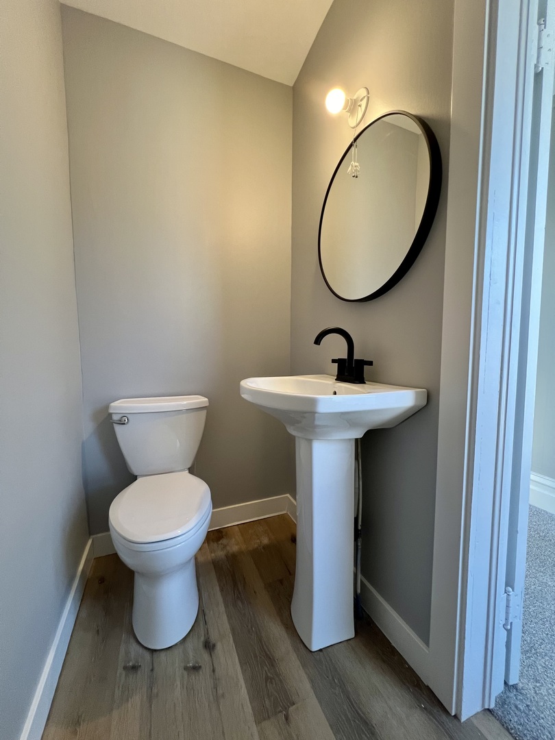 200 East South Street Ellsworth, IL 61737 - Photo 19 of 19 a bathroom with a sink toilet and a mirror