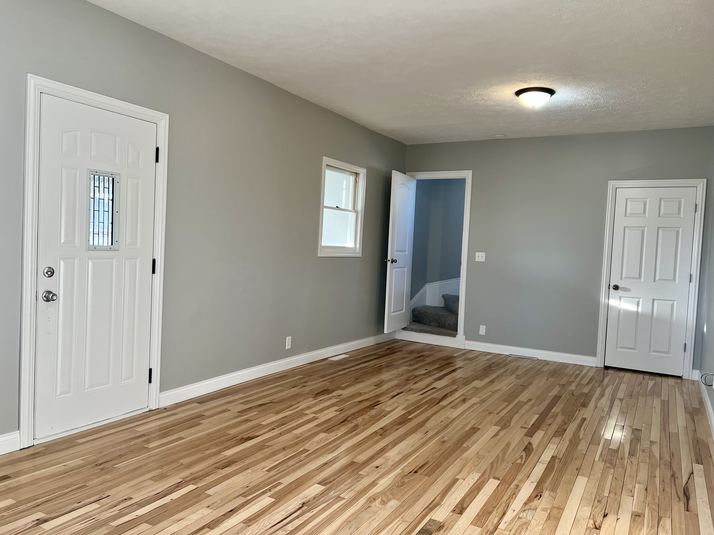 200 East South Street Ellsworth, IL 61737 - Photo 4 of 19 a view of an empty room with wooden floor and a window