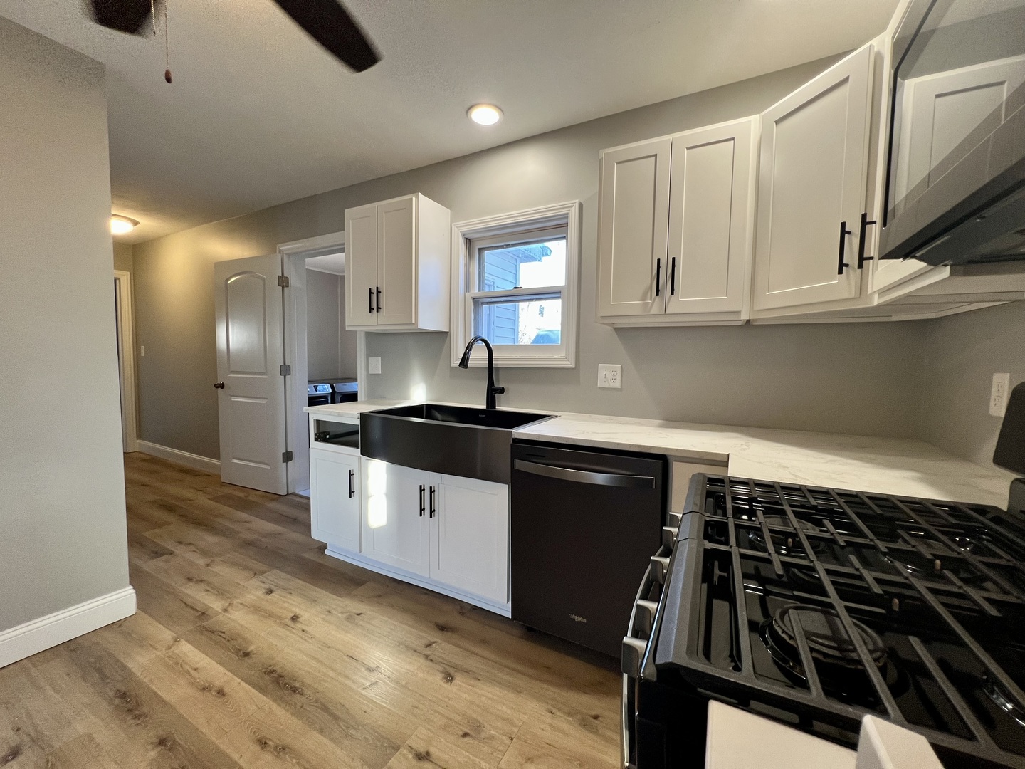 200 East South Street Ellsworth, IL 61737 - Photo 6 of 19 a kitchen with granite countertop a sink stove and cabinets