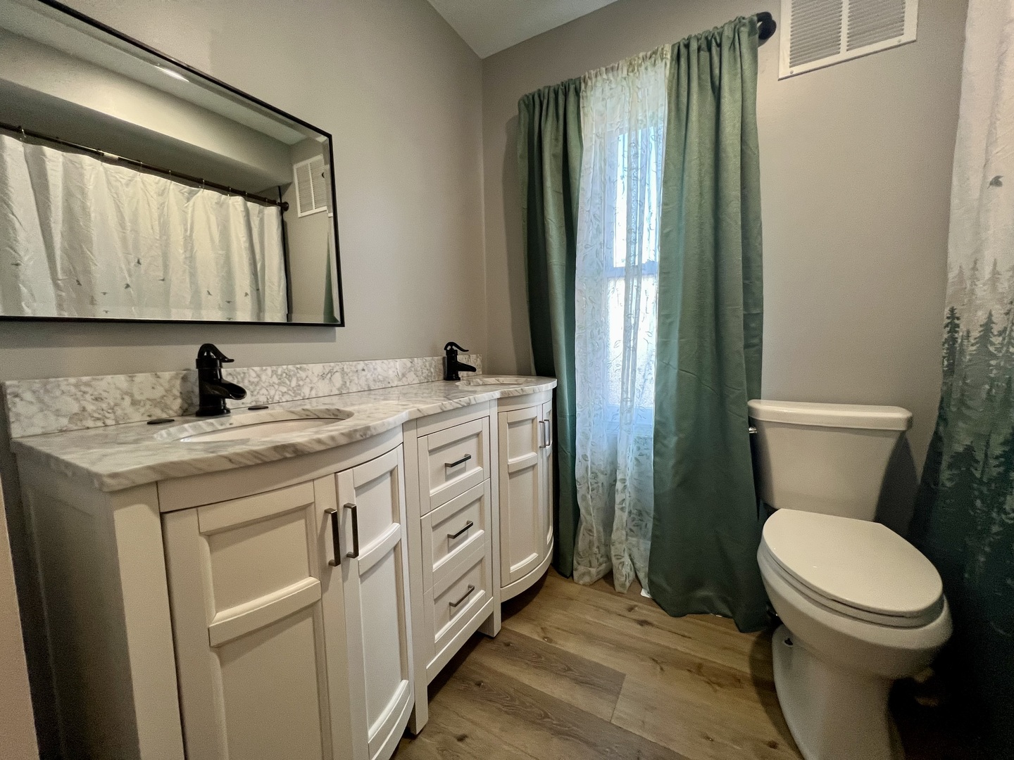 200 East South Street Ellsworth, IL 61737 - Photo 10 of 19 a bathroom with a granite countertop toilet sink and mirror