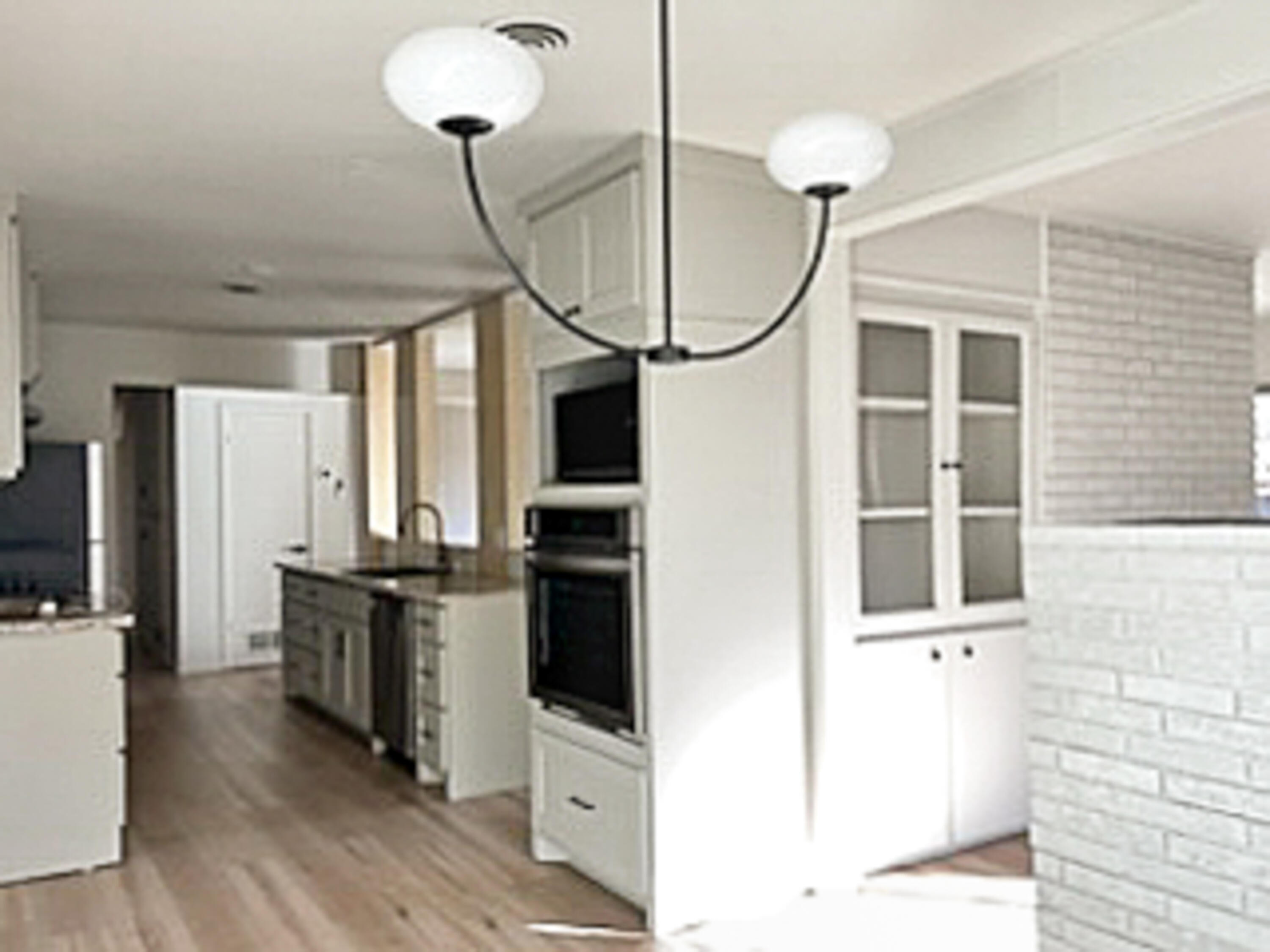 3625 59th Street Lubbock, TX 79413 - Photo 17 of 41 a very nice looking room with wooden floor and cabinets