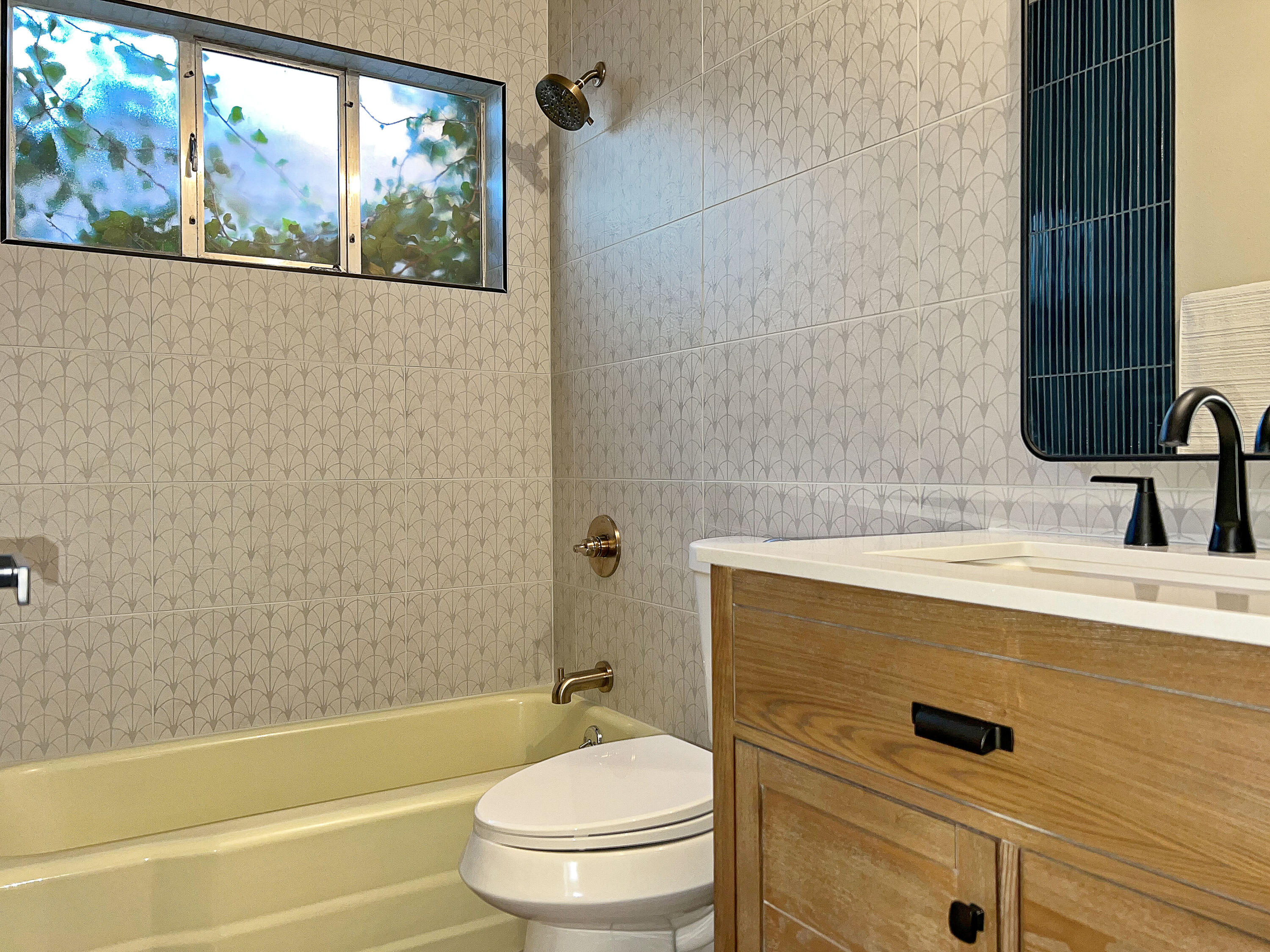 3625 59th Street Lubbock, TX 79413 - Photo 21 of 41 a bathroom with a sink a toilet and shower