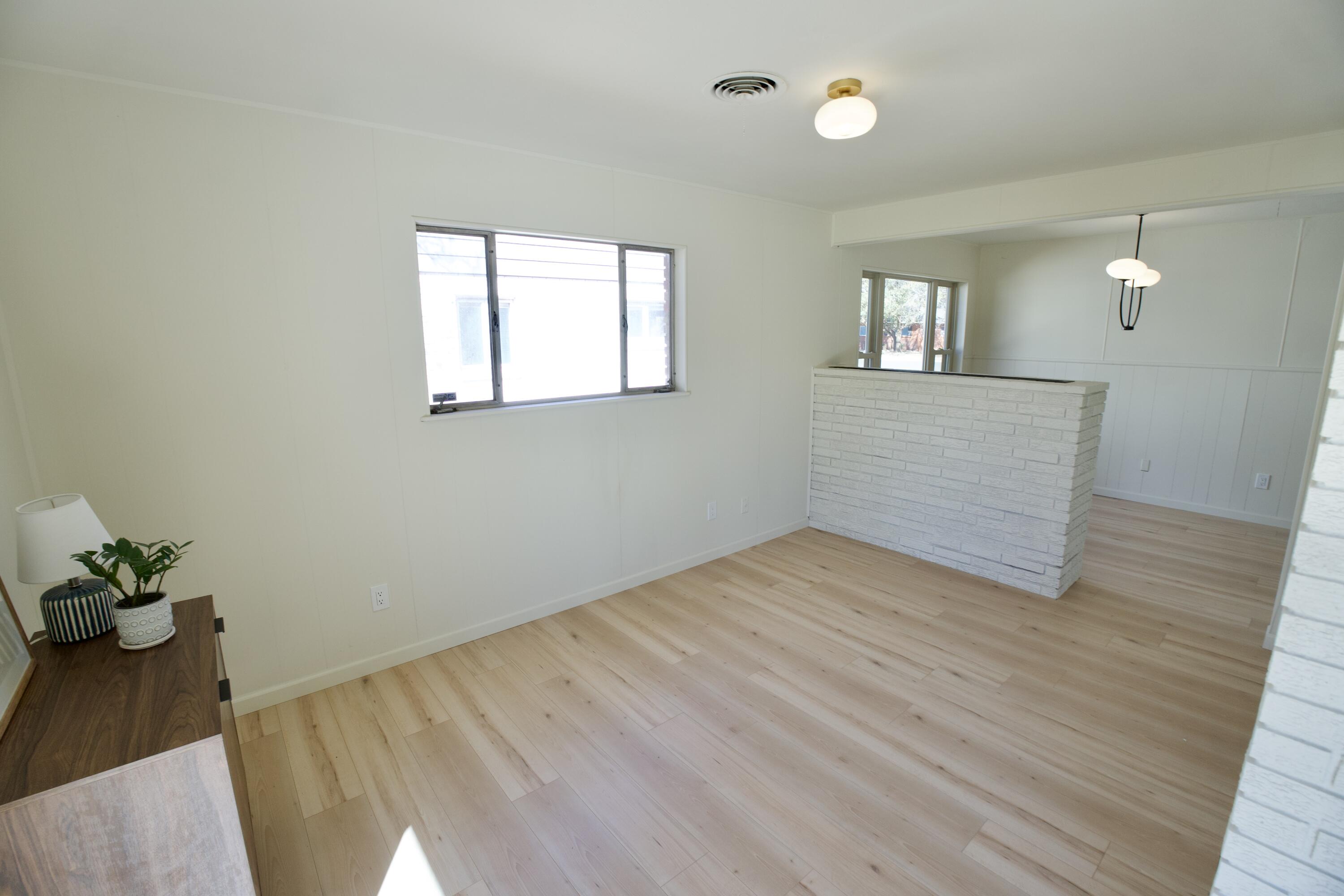 3625 59th Street Lubbock, TX 79413 - Photo 30 of 41 a view of empty room with wooden floor