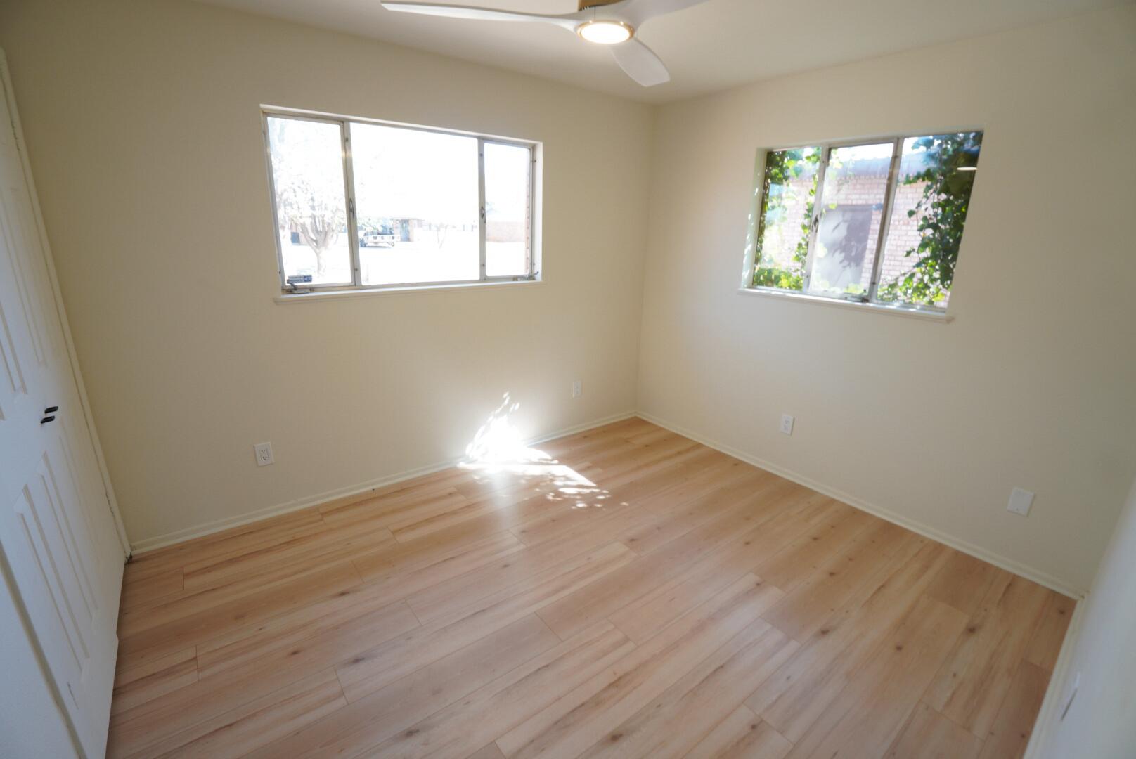 3625 59th Street Lubbock, TX 79413 - Photo 40 of 41 a view of empty room with wooden floor and fan