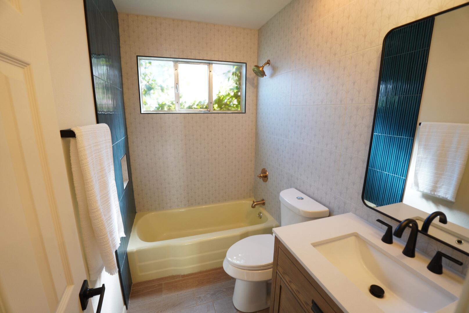 3625 59th Street Lubbock, TX 79413 - Photo 41 of 41 a bathroom with a sink and a bathtub