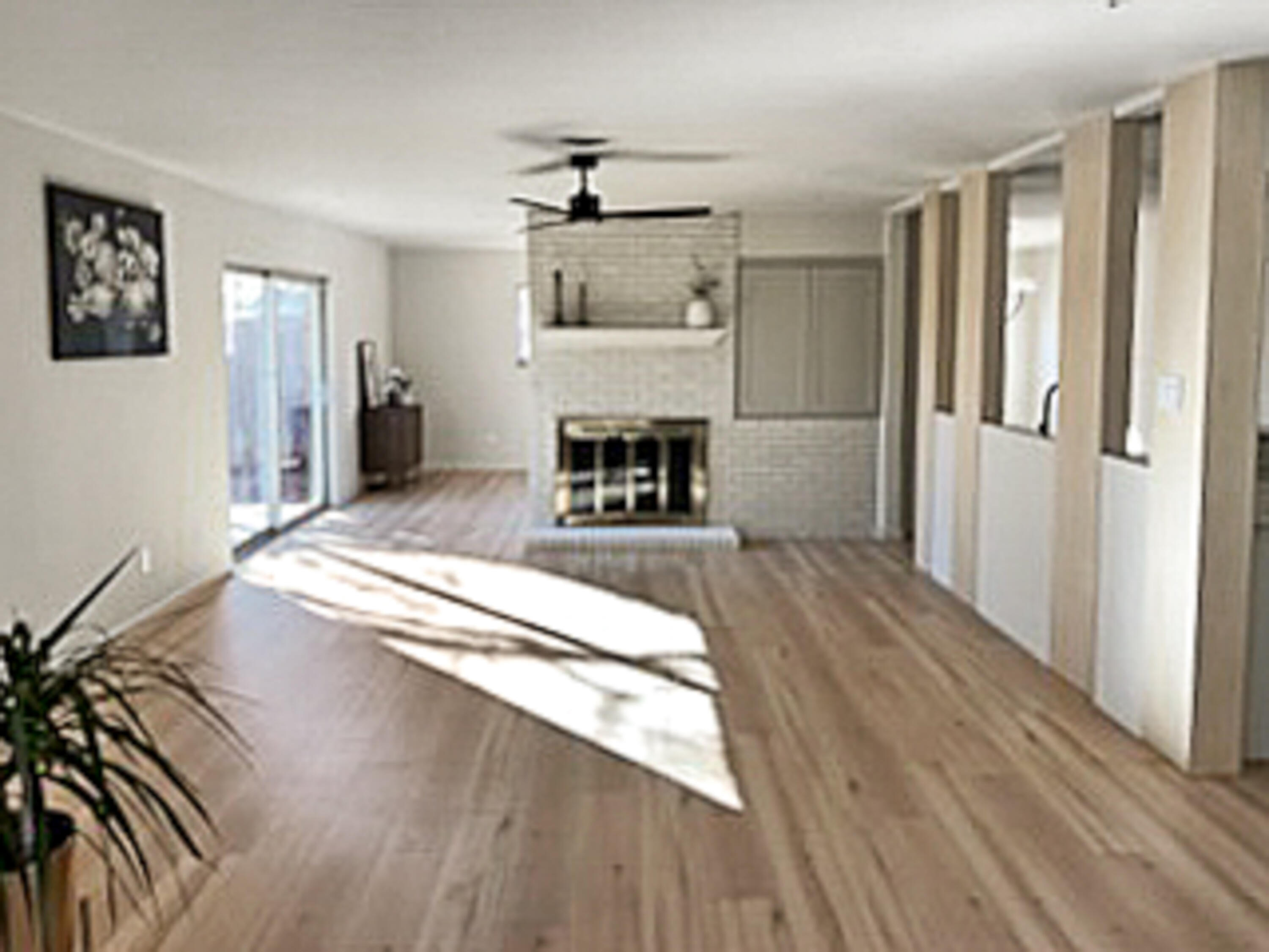 3625 59th Street Lubbock, TX 79413 - Photo 5 of 41 a spacious bedroom with a bed and a chandelier