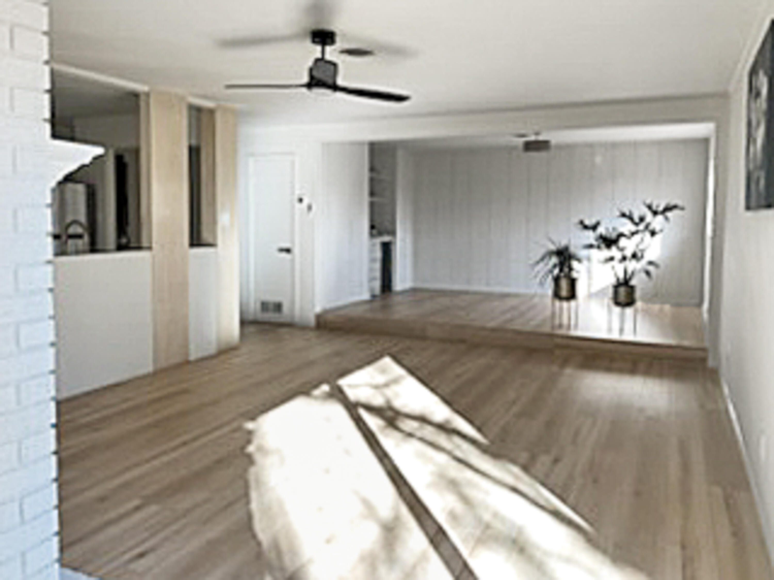 3625 59th Street Lubbock, TX 79413 - Photo 7 of 41 a view of a livingroom with wooden floor and a ceiling fan