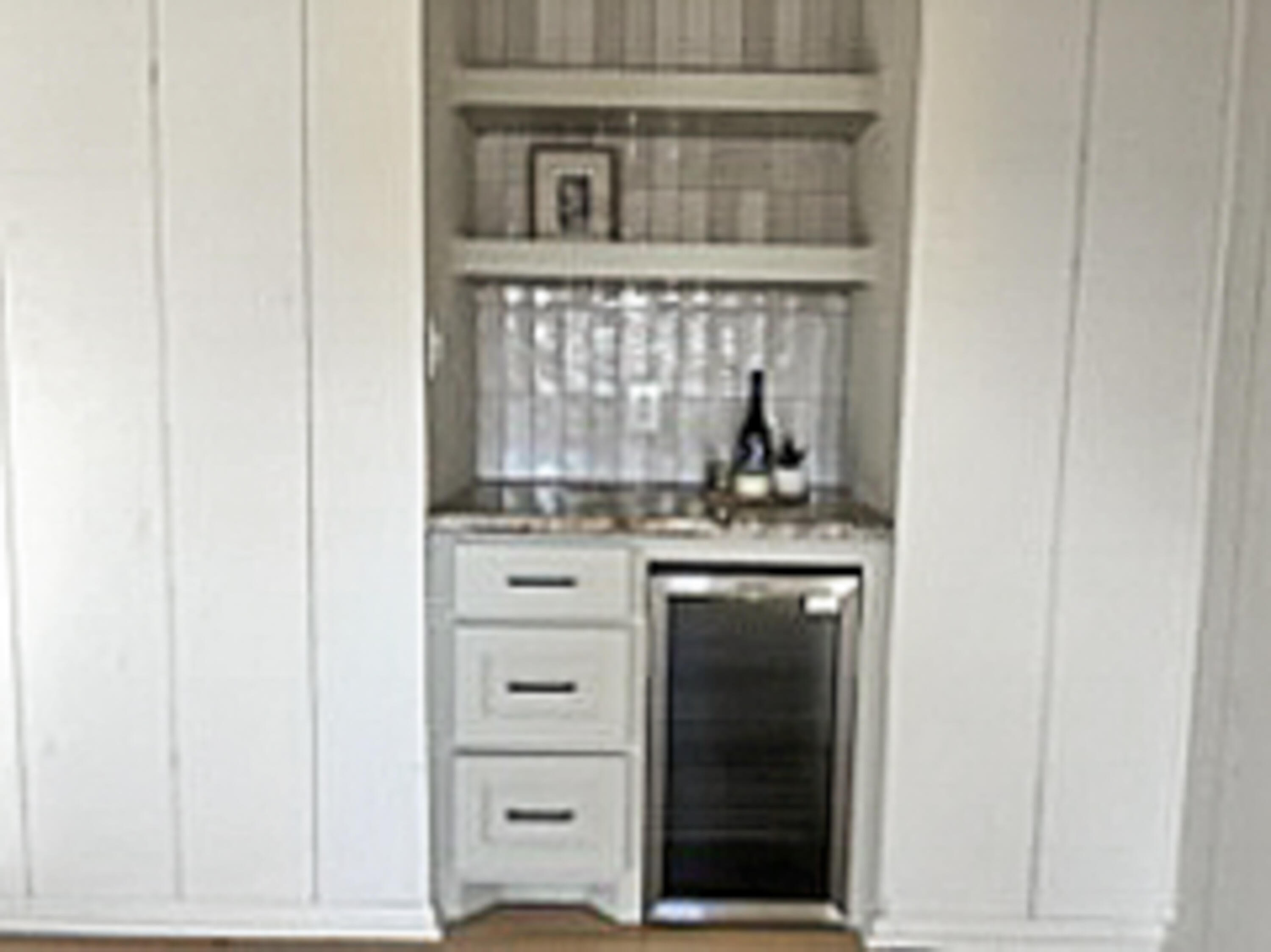 3625 59th Street Lubbock, TX 79413 - Photo 9 of 41 a bathroom with a granite countertop sink and a mirror