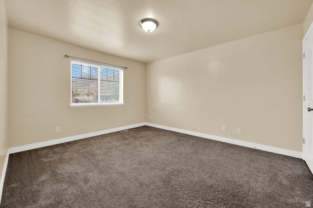 1179 West 100 South Springville, UT 84663 - Photo 7 of 32 Neutral-toned walls complement the dark carpeting