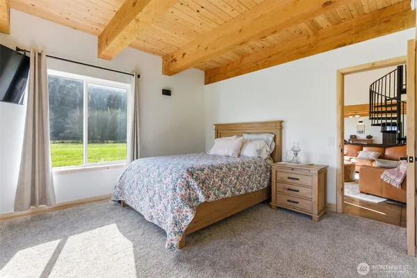 a bedroom with a bed and a cabinets