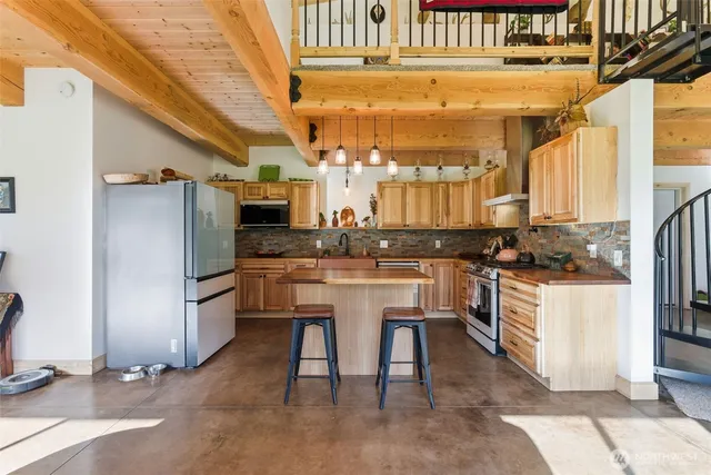 a kitchen with a refrigerator and countertop