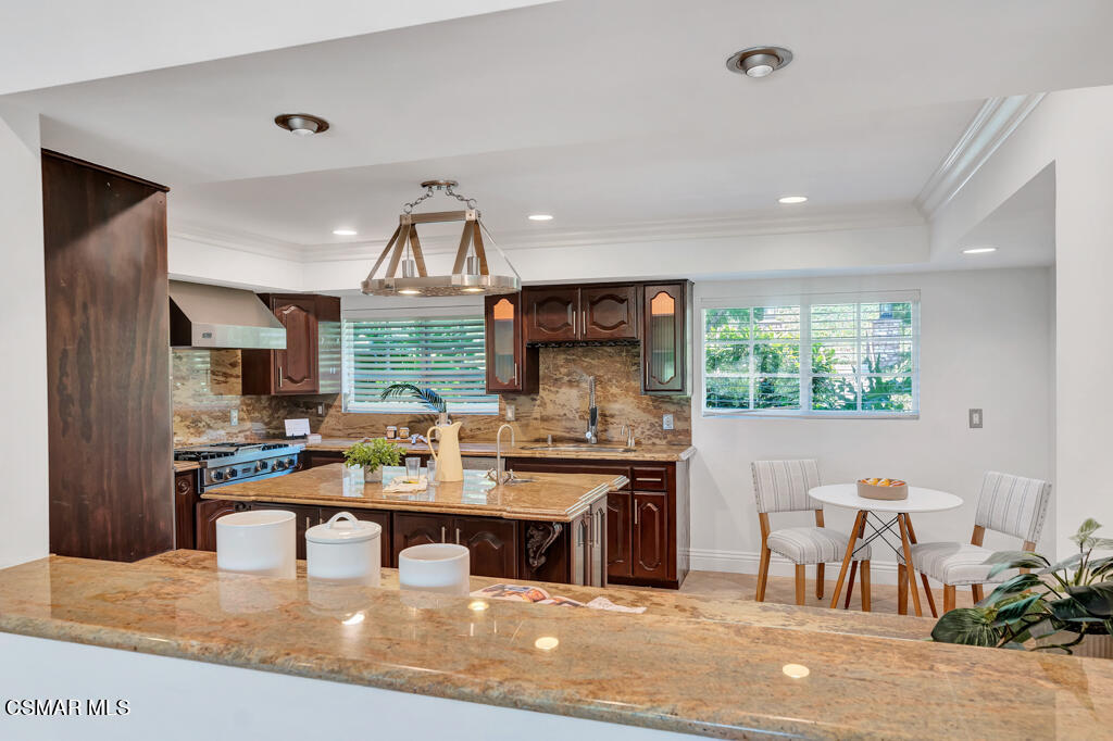 1631 Hauser Circle Thousand Oaks, CA 91362 - Photo 12 of 56 a kitchen with a stove a sink and a refrigerator