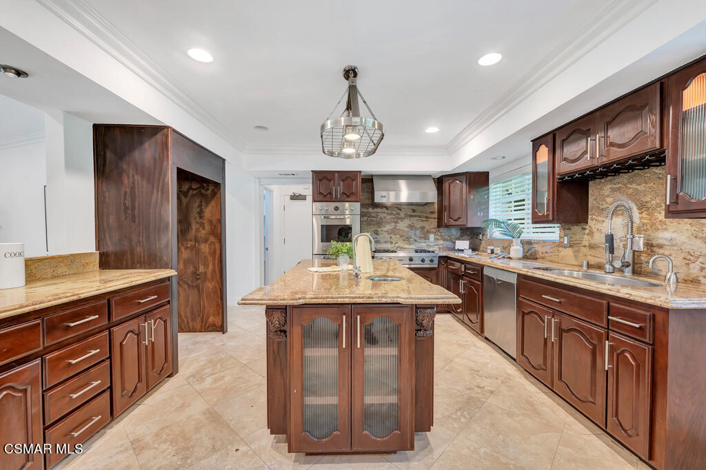 1631 Hauser Circle Thousand Oaks, CA 91362 - Photo 13 of 56 a kitchen with granite countertop a sink dishwasher stove and cabinets