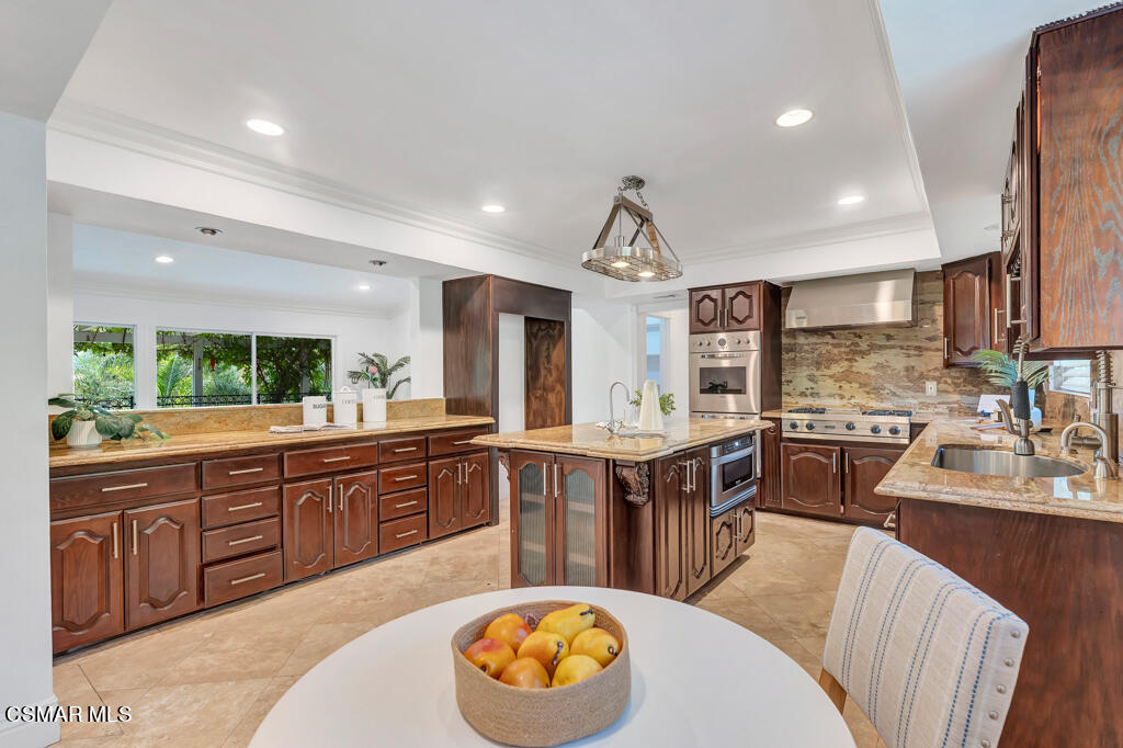 1631 Hauser Circle Thousand Oaks, CA 91362 - Photo 14 of 56 a large kitchen with kitchen island a large island in it
