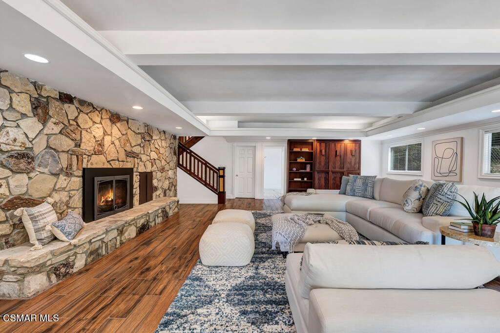 1631 Hauser Circle Thousand Oaks, CA 91362 - Photo 23 of 56 a living room with furniture a flat screen tv and a fireplace