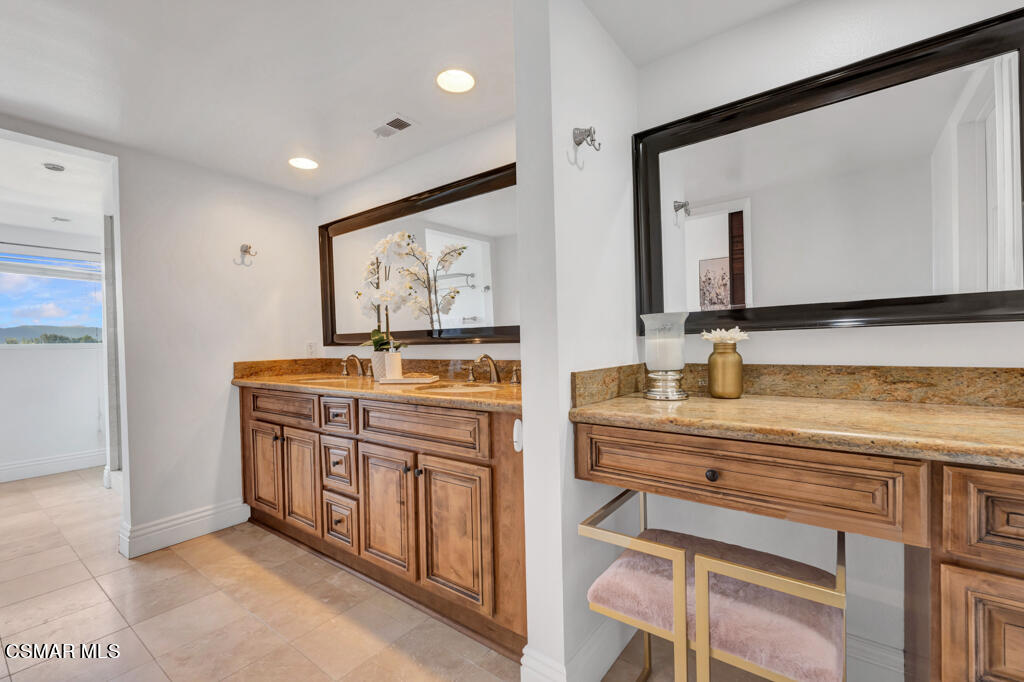 1631 Hauser Circle Thousand Oaks, CA 91362 - Photo 30 of 56 a view of cabinets a sink and a mirror in a room