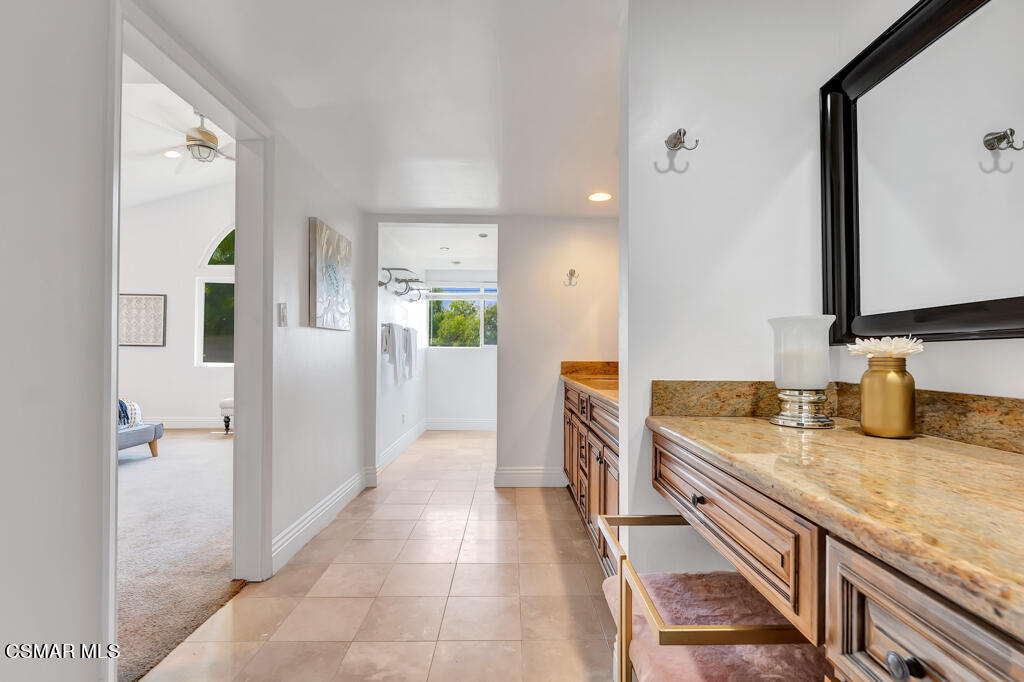 1631 Hauser Circle Thousand Oaks, CA 91362 - Photo 31 of 56 a bathroom with a granite countertop sink and a mirror