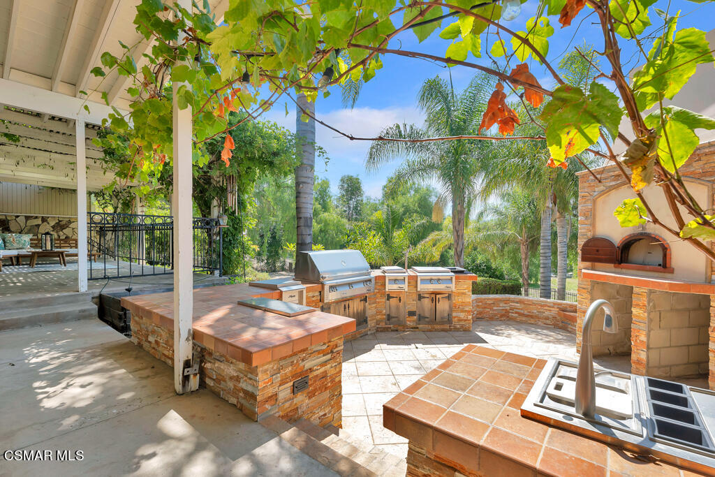 1631 Hauser Circle Thousand Oaks, CA 91362 - Photo 45 of 56 a view of a patio with couches table and chairs and potted plants