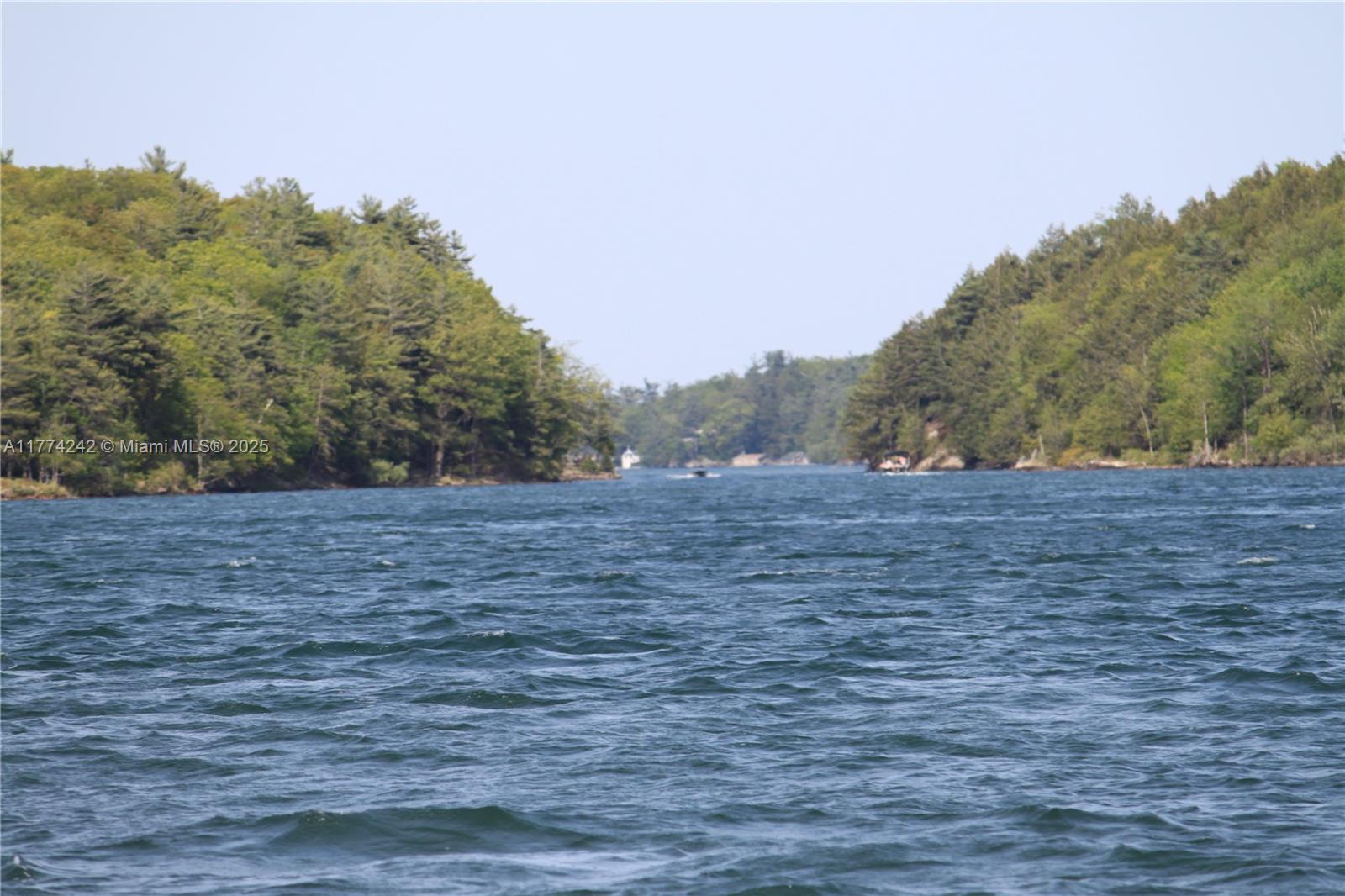 18443 Otter Point Road Wellesley Island, NY 13640 - Photo 10 of 26 "The Narrows," just minutes from your backyard, is a natural opening in Lake of the Isles to the St. Lawrence River. Hill Island, Ontario, Canada is to the left and Wellesley Island, New York, United States to the right. You can go boating from your backyard to anywhere.