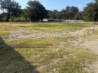 207 Northeast Front Street Millsap, TX 76066 - Photo 2 of 8 a view of a swimming pool with a big yard