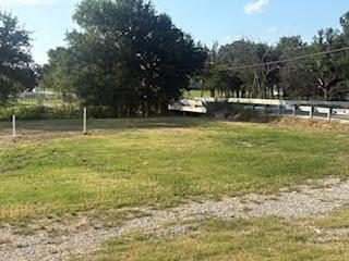 207 Northeast Front Street Millsap, TX 76066 - Photo 4 of 8 a house with river in front of it