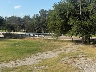 207 Northeast Front Street Millsap, TX 76066 - Photo 5 of 8 a view of a swimming pool with a yard
