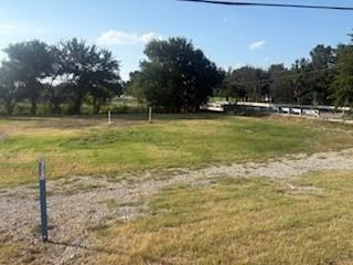 207 Northeast Front Street Millsap, TX 76066 - Photo 8 of 8 a view of outdoor space with deck and yard