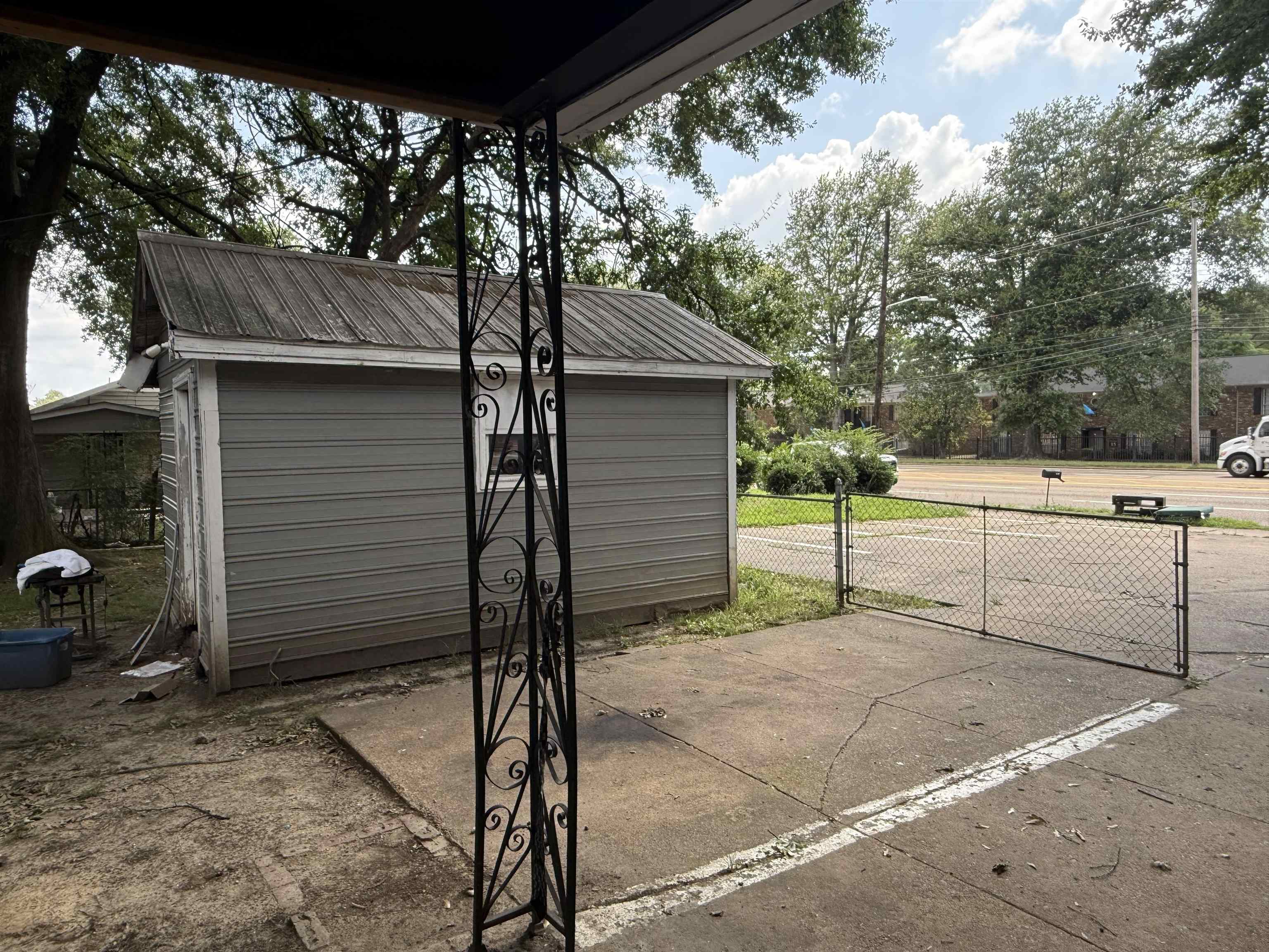 2930 Getwell Road Memphis, TN 38118 - Photo 23 of 25 Detached outbuilding with metal roof and horizontal siding