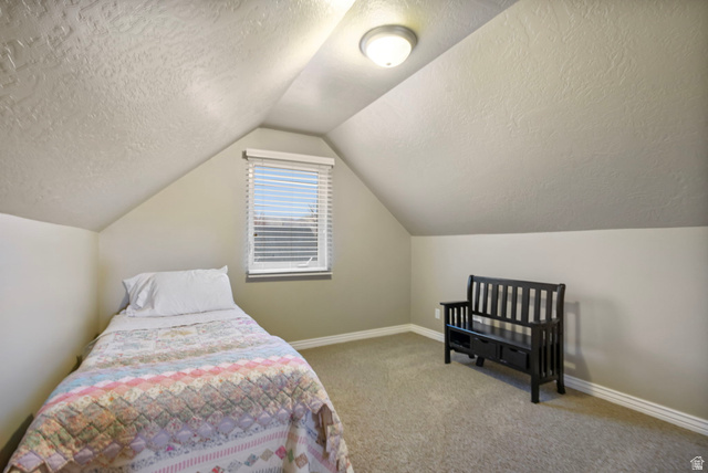 557 South 1470th Street East Springville, UT 84663 - Photo 24 of 46 Bedroom with light carpet and a textured ceiling