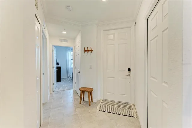 a living room with furniture a mirror and a sink