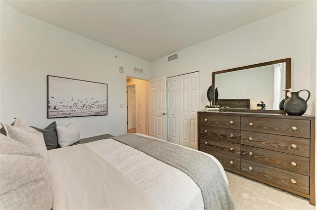 a view of a swimming pool with outdoor seating