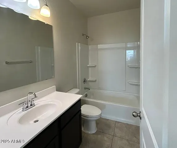 a bathroom with a sink toilet tub and shower