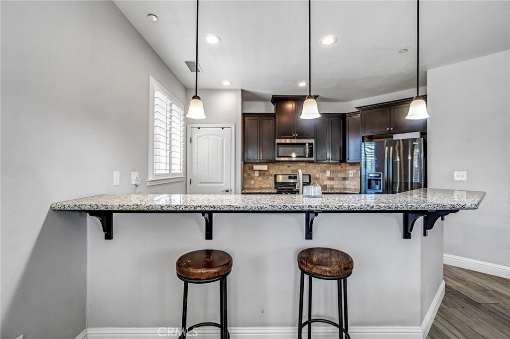 294 Double Tree Court Madera, CA 93637 - Photo 11 of 40 a kitchen with lots of counter space and a sink