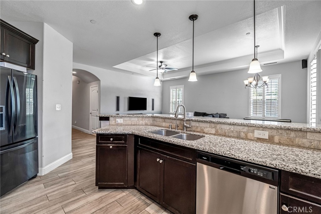 294 Double Tree Court Madera, CA 93637 - Photo 17 of 40 a kitchen with lots of counter space and a sink
