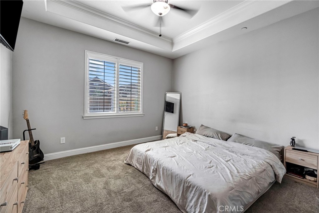 294 Double Tree Court Madera, CA 93637 - Photo 24 of 40 a bedroom with bed and a window