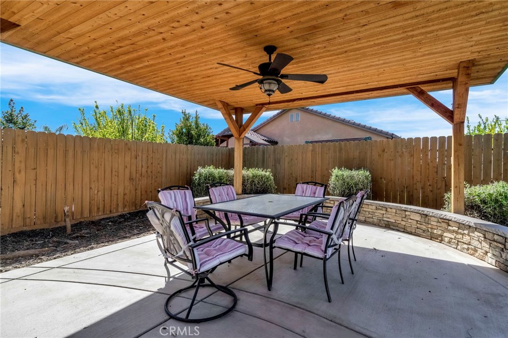 294 Double Tree Court Madera, CA 93637 - Photo 29 of 40 a patio with a table and chairs