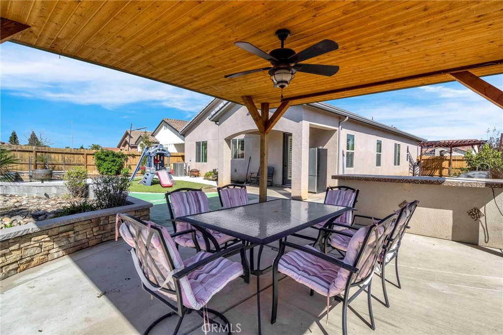 294 Double Tree Court Madera, CA 93637 - Photo 30 of 40 a view of a patio with a table and chairs