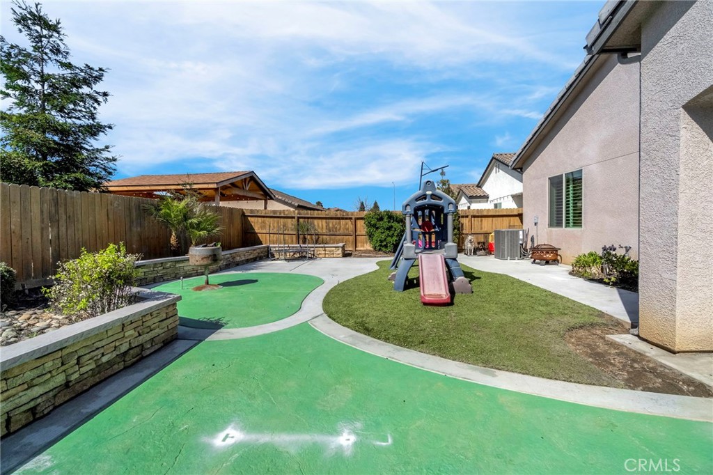 294 Double Tree Court Madera, CA 93637 - Photo 31 of 40 a view of a house with backyard porch and sitting area