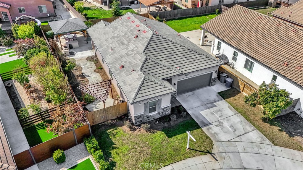 294 Double Tree Court Madera, CA 93637 - Photo 37 of 40 an aerial view of a house with a yard and potted plants